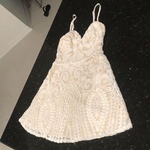 XS Mini Dress by Superdown.  No tags, never worn. Beautiful beaded mini dress!